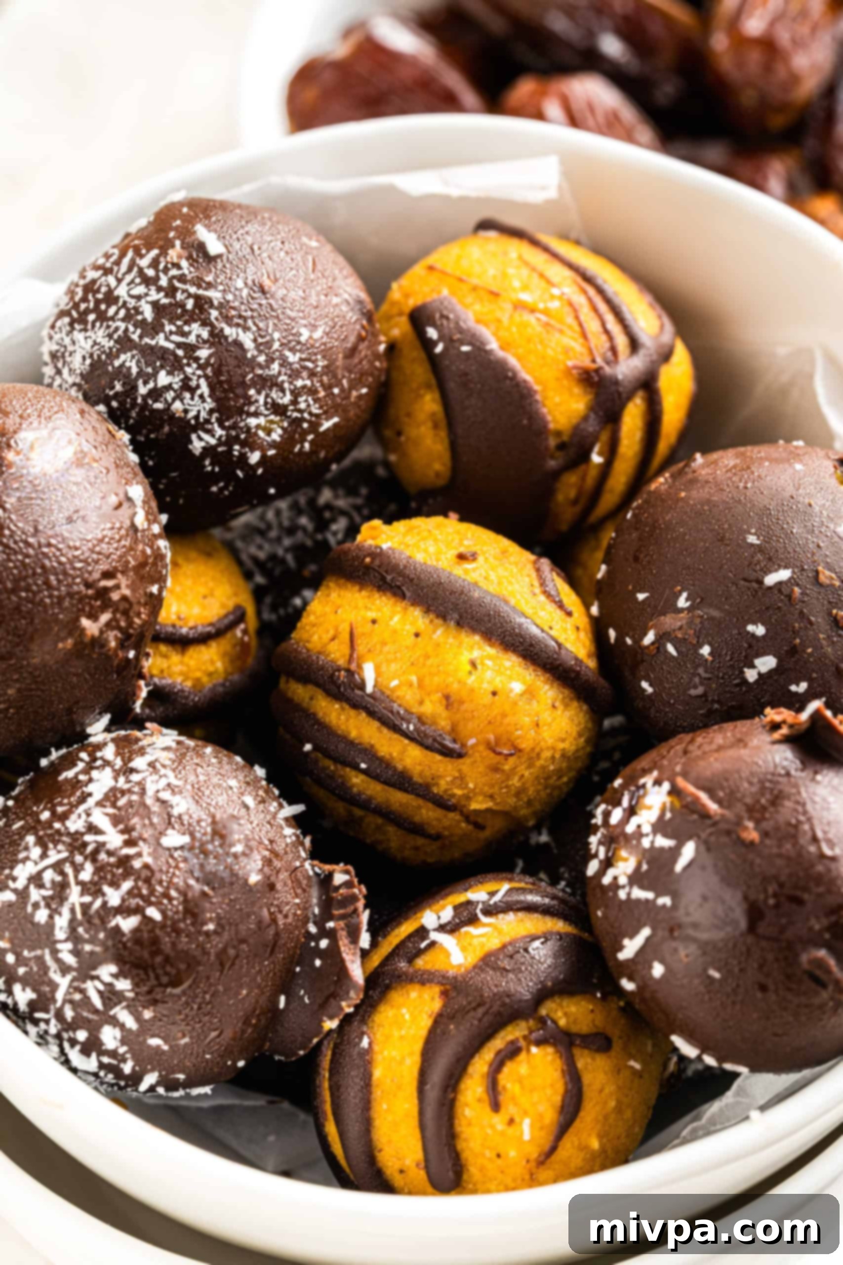 Gluten-Free Pumpkin Truffles (Gluten-Free, Vegan) A charming bowl overflowing with healthy pumpkin truffles, ready for a fall gathering.