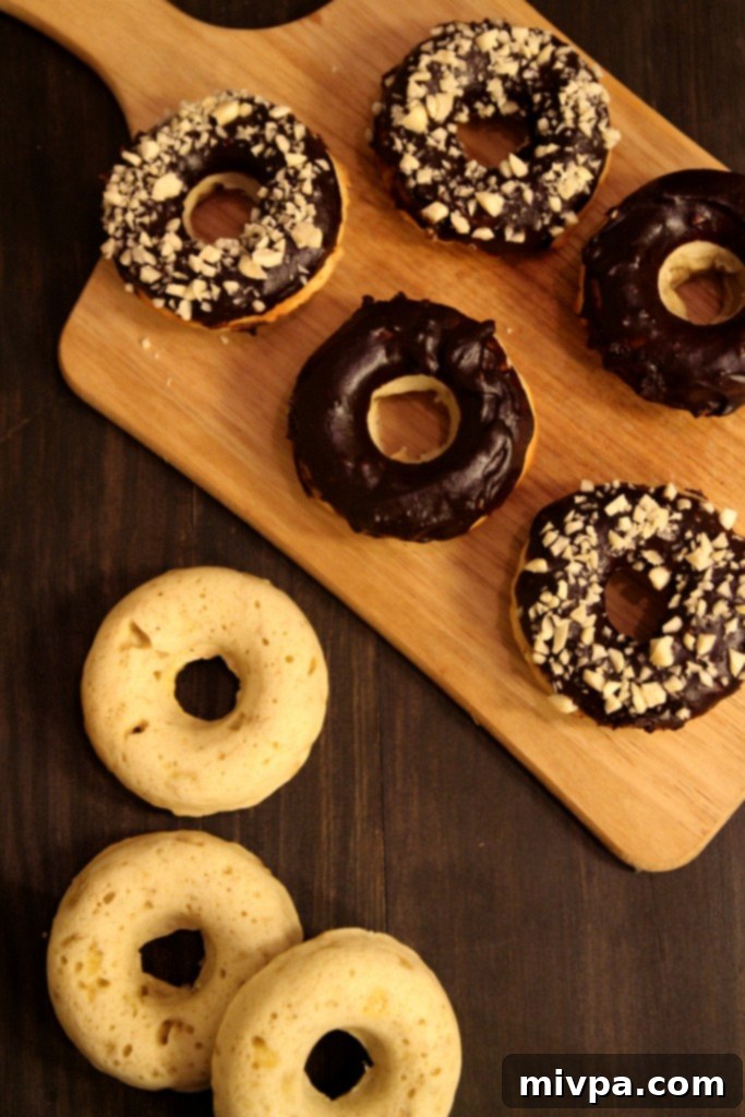 Baked Banana Doughnuts with Chocolate Glaze and Almonds close up