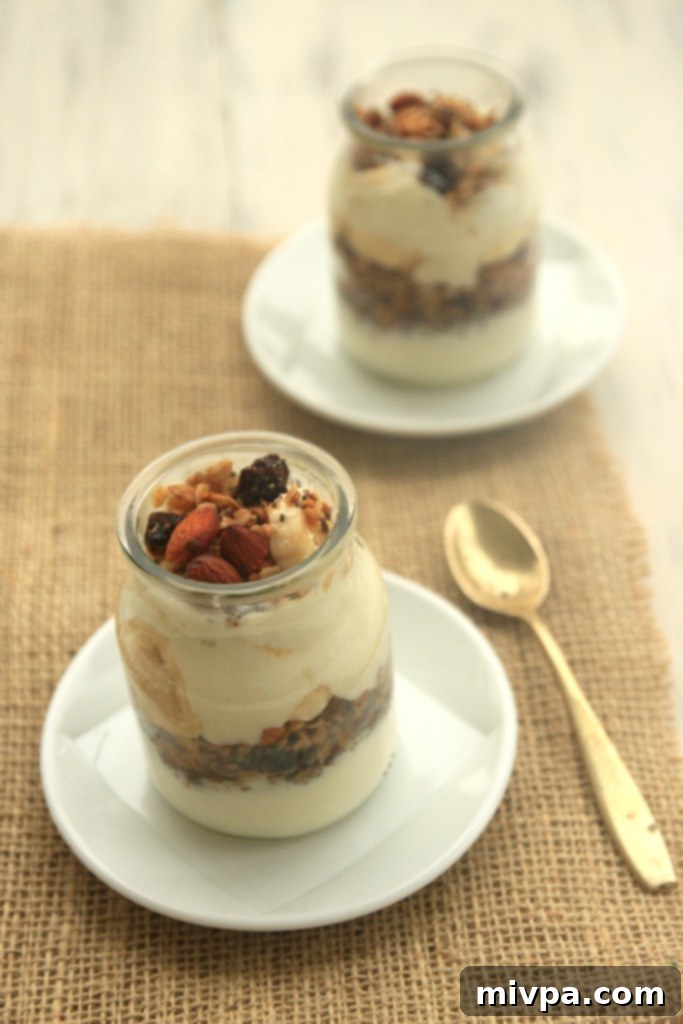 A bowl of Gluten-Free Almond Granola with fresh berries and yogurt