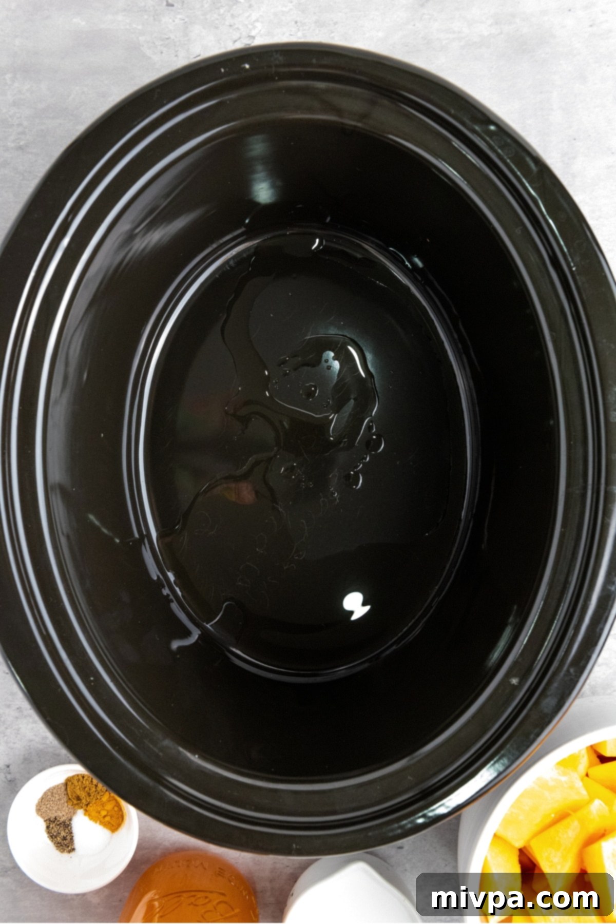 Crockpot Butternut Squash Soup (Gluten-Free, Vegan) Oil in a crockpot.