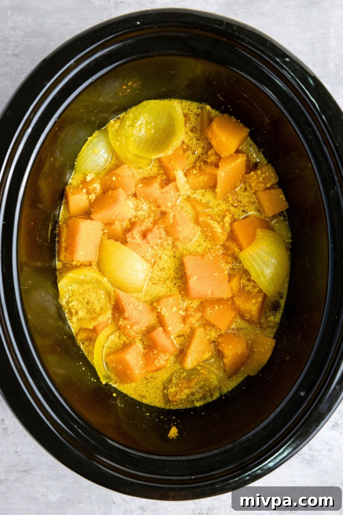 Vegan Butternut Squash Soup (Gluten-Free) Cooked butternut squash, onions and gravy in crockpot.