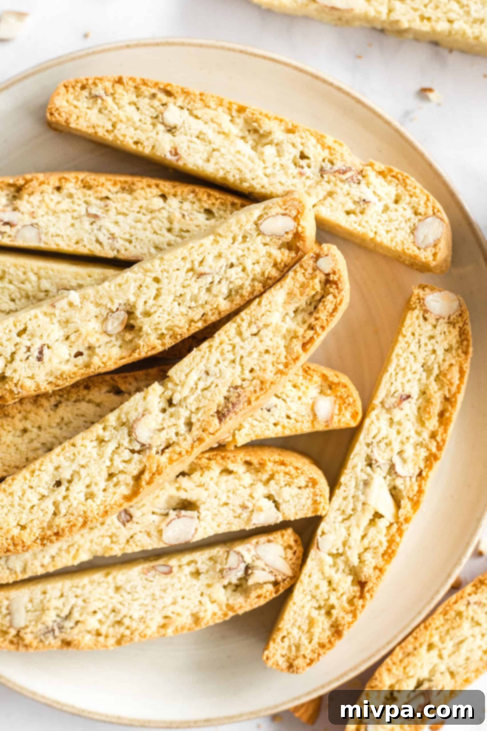 An abundant plate filled with delicious gluten-free almond biscotti, showcasing a freshly baked batch ready for serving.
