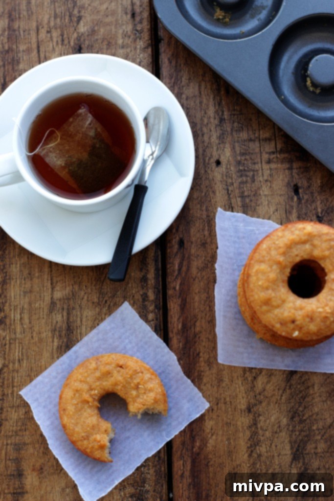 Homemade Grain-free Apple Cider Vinegar Doughnuts cooling on a rack