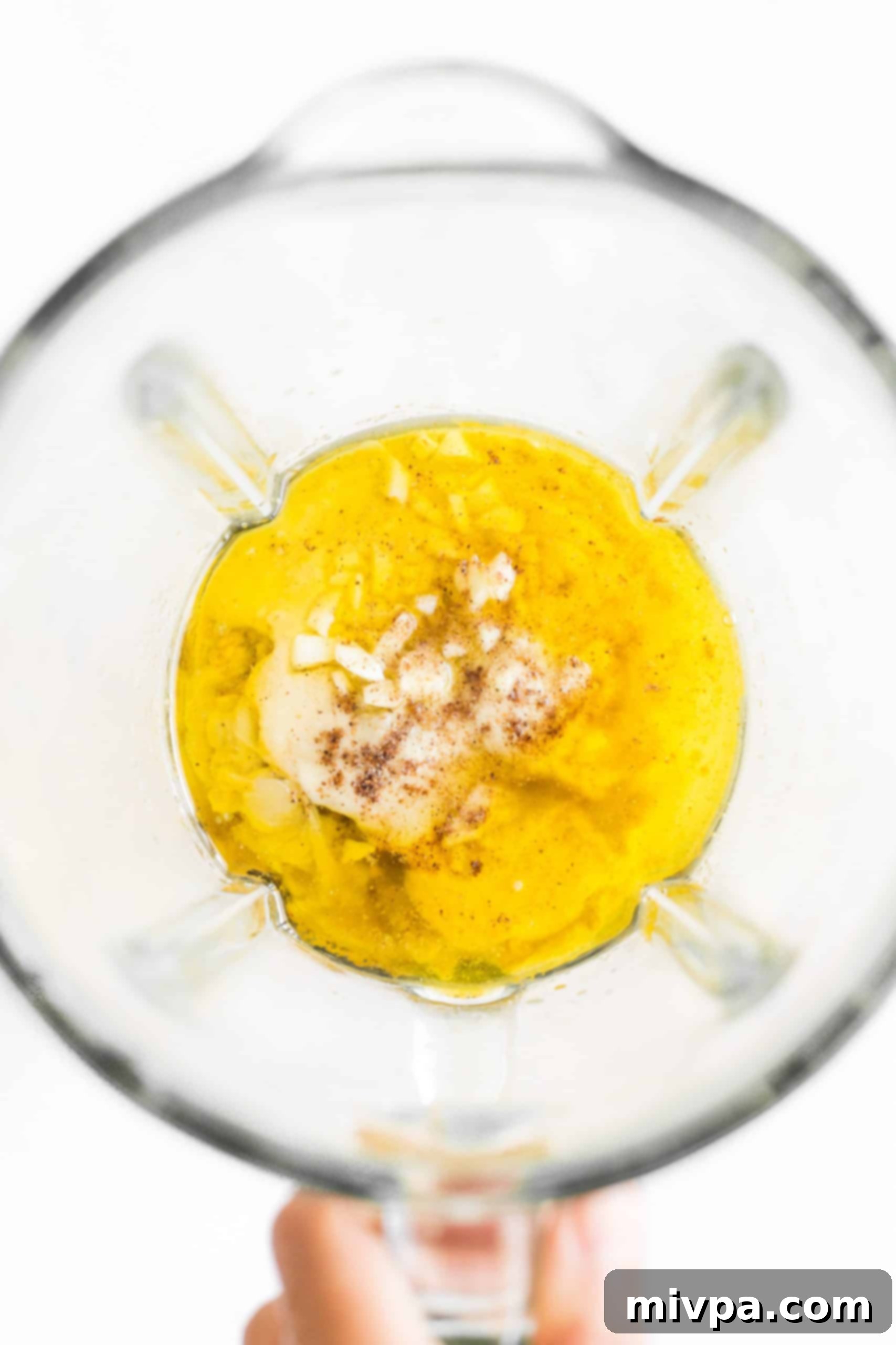 Ingredients in the bowl of a blender.