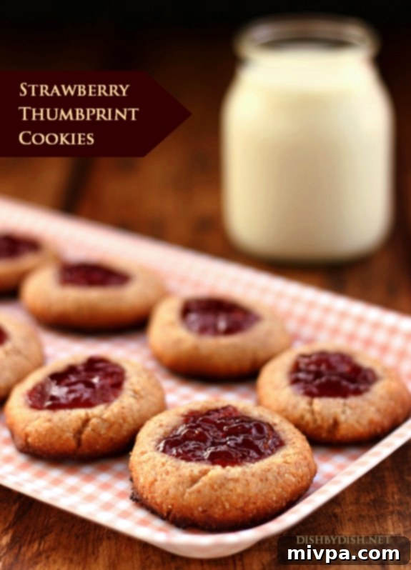 Berry-Kissed Grain-Free Thumbprints 2 Grain-free Strawberry Thumbprint Cookies - Close up of a single cookie