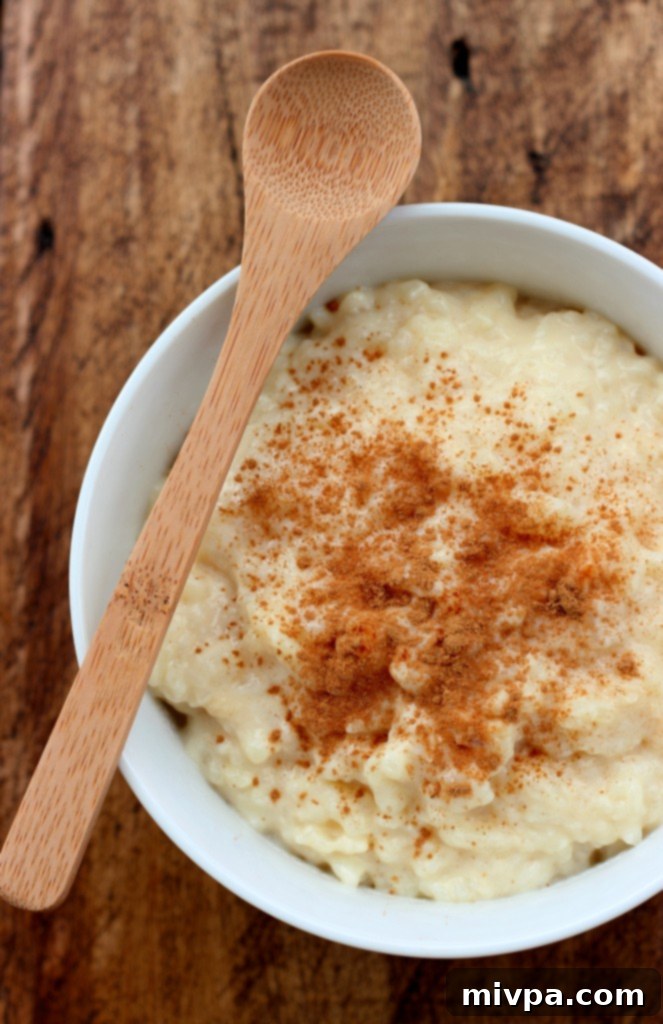 Arroz con Leche (Milk Rice Pudding) simmering in a pot