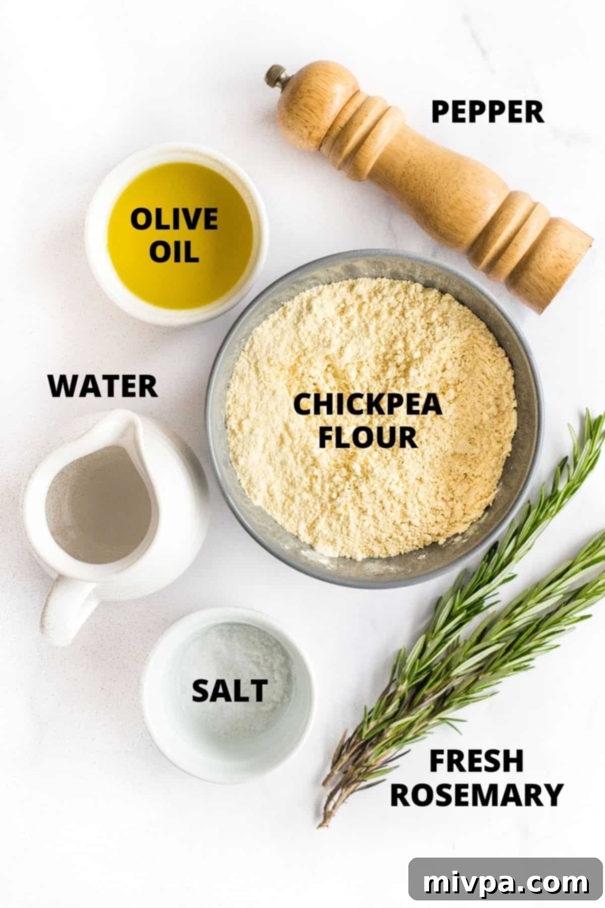 Easy Farinata Recipe - Chickpea Flatbread (Gluten-Free, Vegan) A collection of ingredients for making farinata (chickpea flour, water, olive oil, rosemary, salt, pepper) arranged on a marble board.