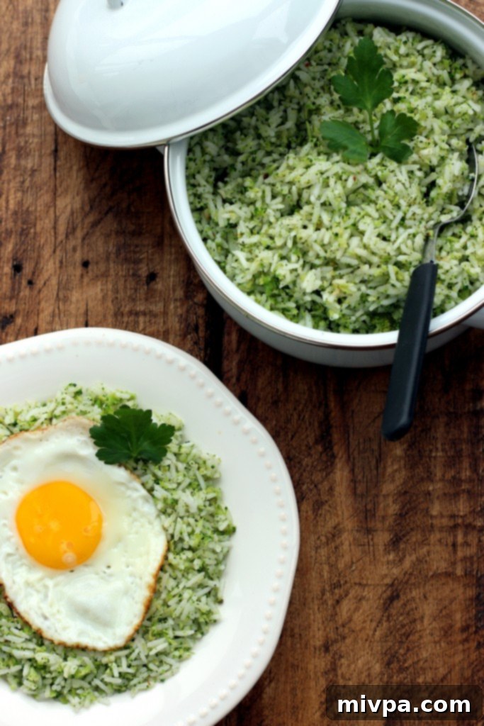 Easy Broccoli Garlic Rice being stirred in a large pan during cooking