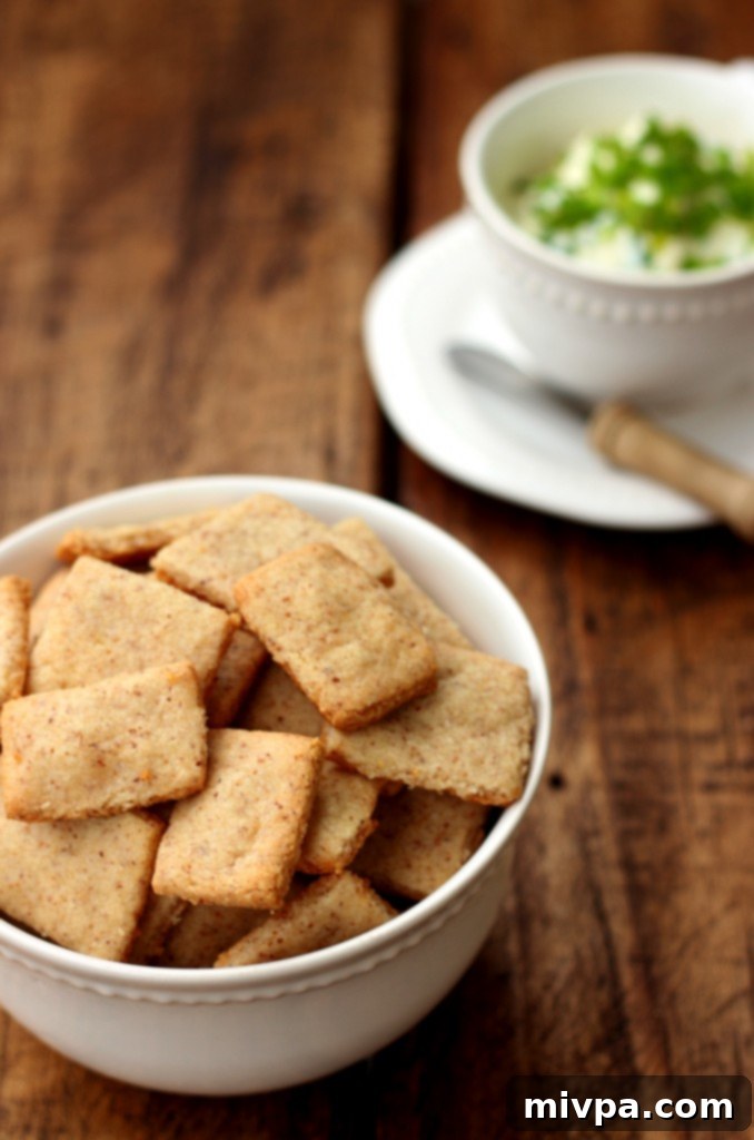 Grain-free Cheese Crackers stacked with herbs