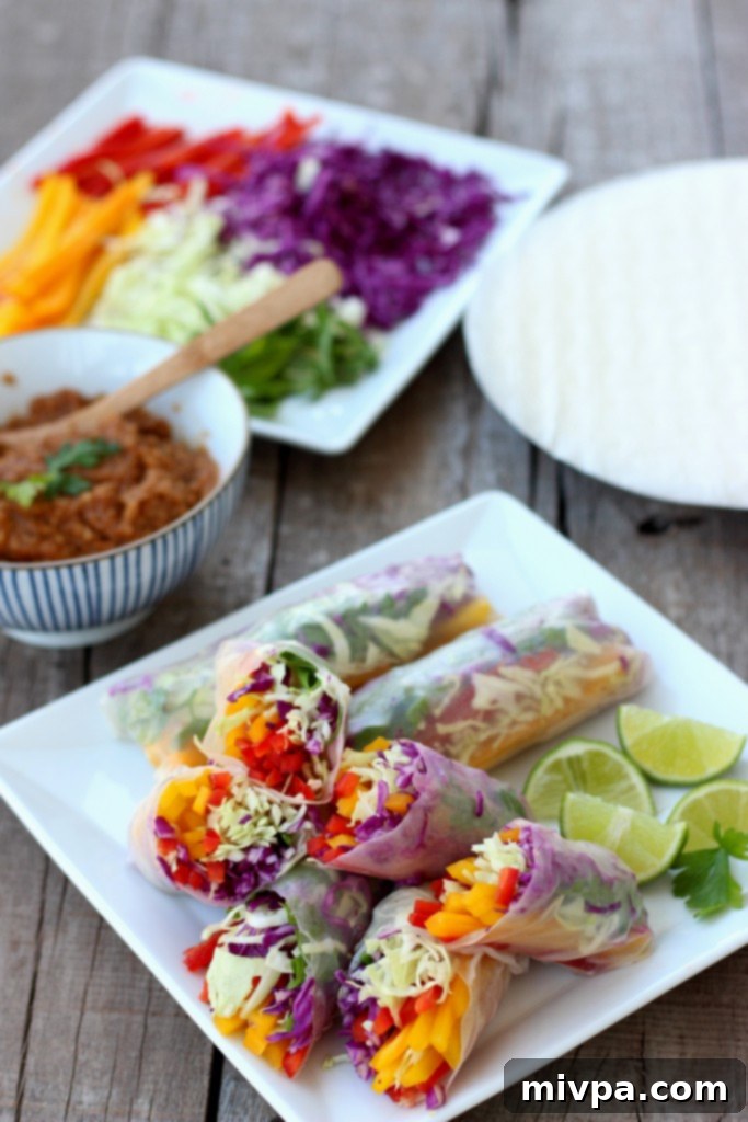Hands preparing fresh Rainbow Vegetable Rolls