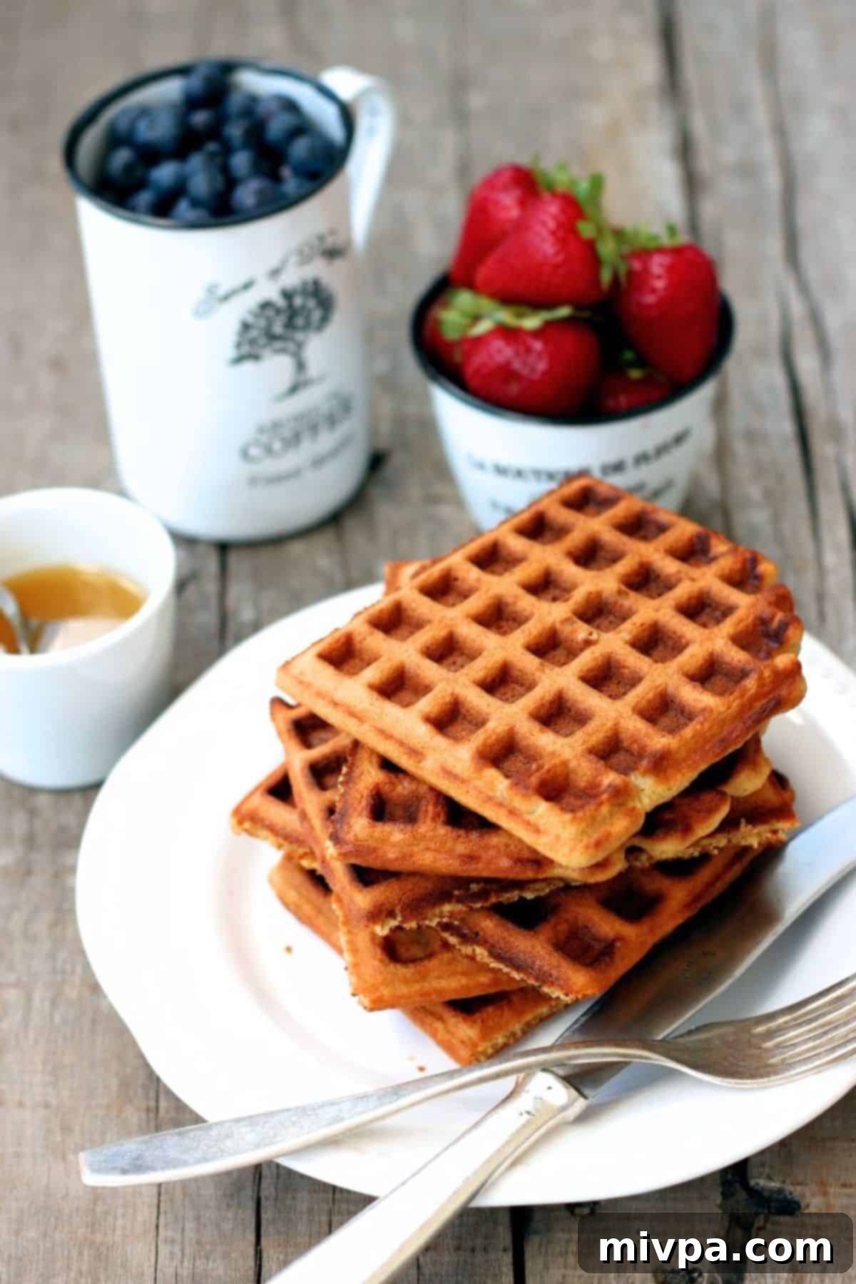 A beautiful spread of oat waffles and fresh fruits, perfect for a healthy breakfast.