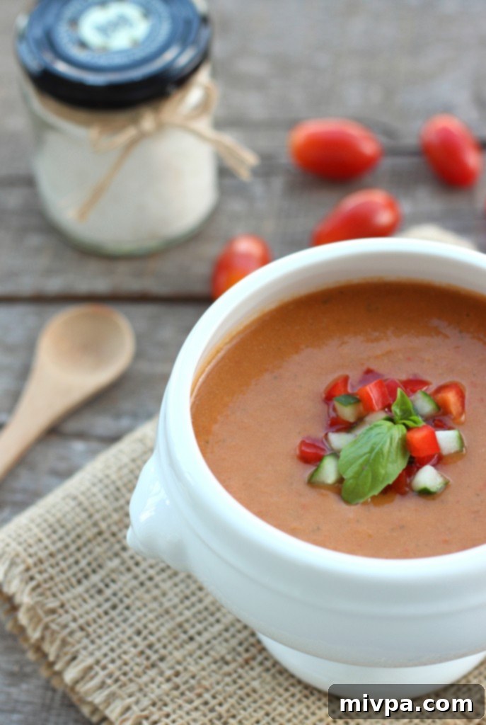 Delicious Tomato & Bell Pepper Gazpacho in a bowl, ready to be served.