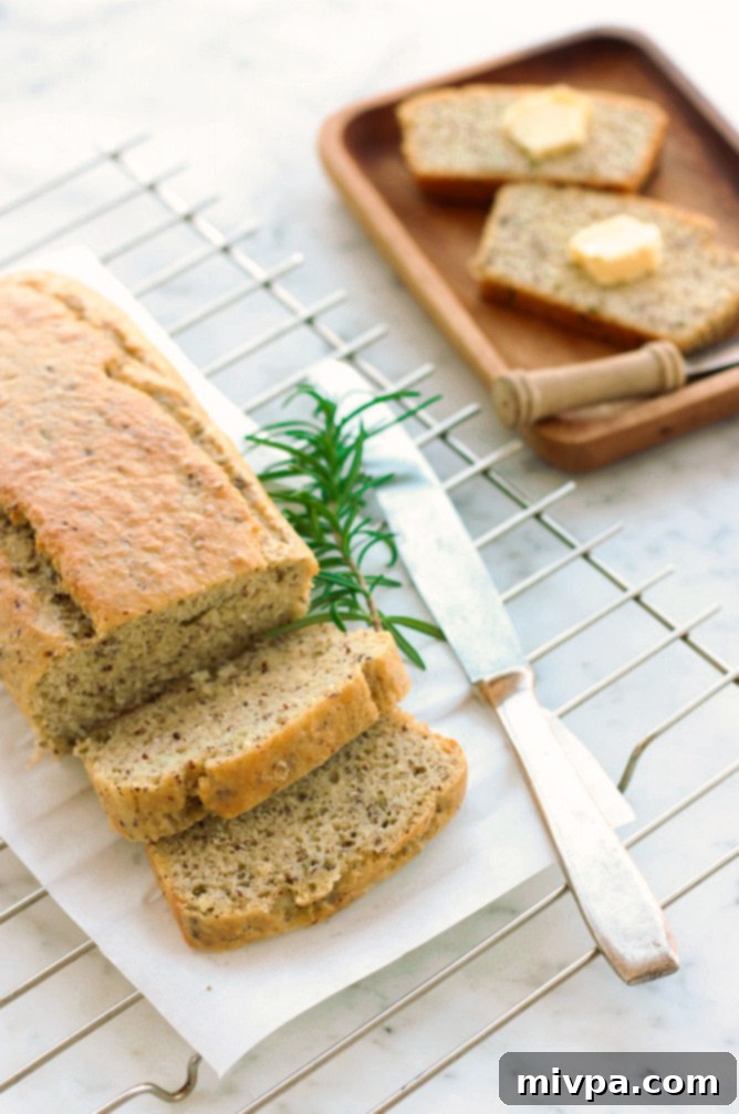 Sliced Grain-free Rosemary Almond Bread with fresh rosemary sprigs