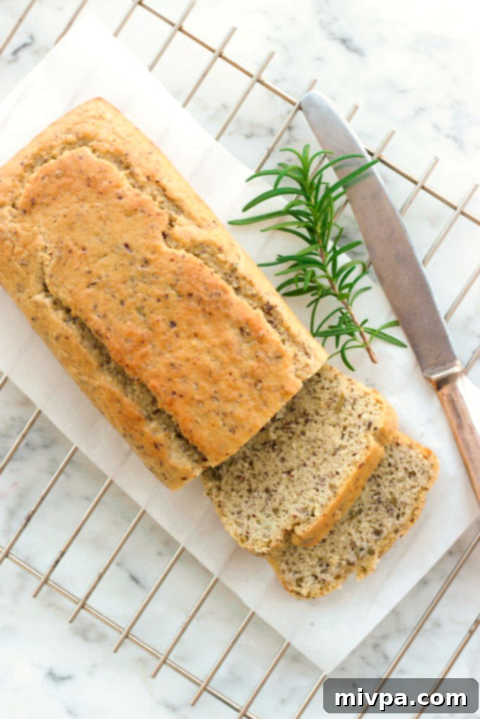 Grain-free Rosemary Almond Bread loaf on a cooling rack