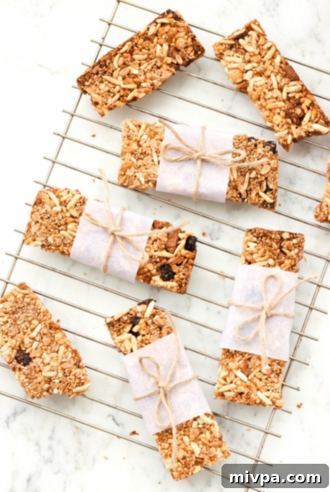 Homemade gluten-free granola bars cooling on wire rack, showcasing their golden-brown, crunchy texture.