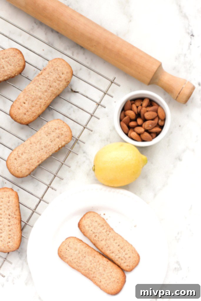 Almond flour shortbread cookies on plate and wire rack.
