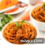 Spicy Chimichurri Carrot Noodles 6 Carrot Noodles with Spicy Chimichurri Sauce, overhead shot in a bowl