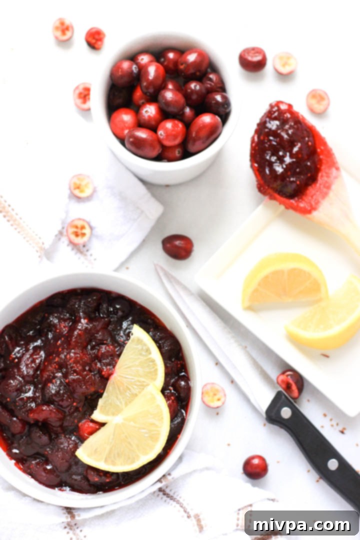 Vegan Gluten-Free Cranberry Sauce Recipe A bowl of gluten-free cranberry sauce on the table.
