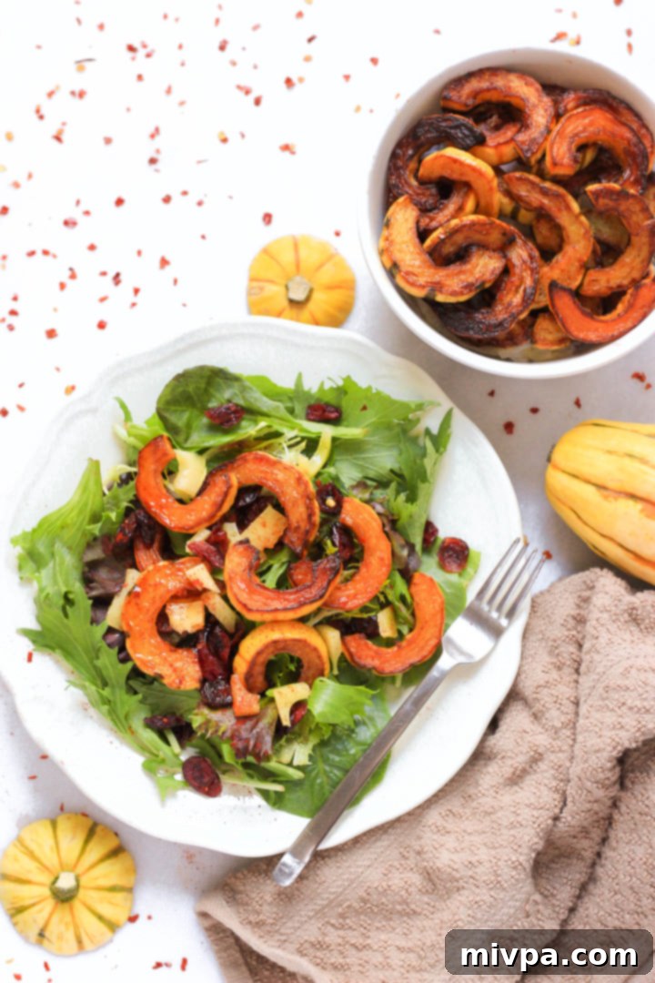 Roasted Delicata Squash Salad (Gluten-Free, Vegan) A plate of delicata squash salad with a fork.