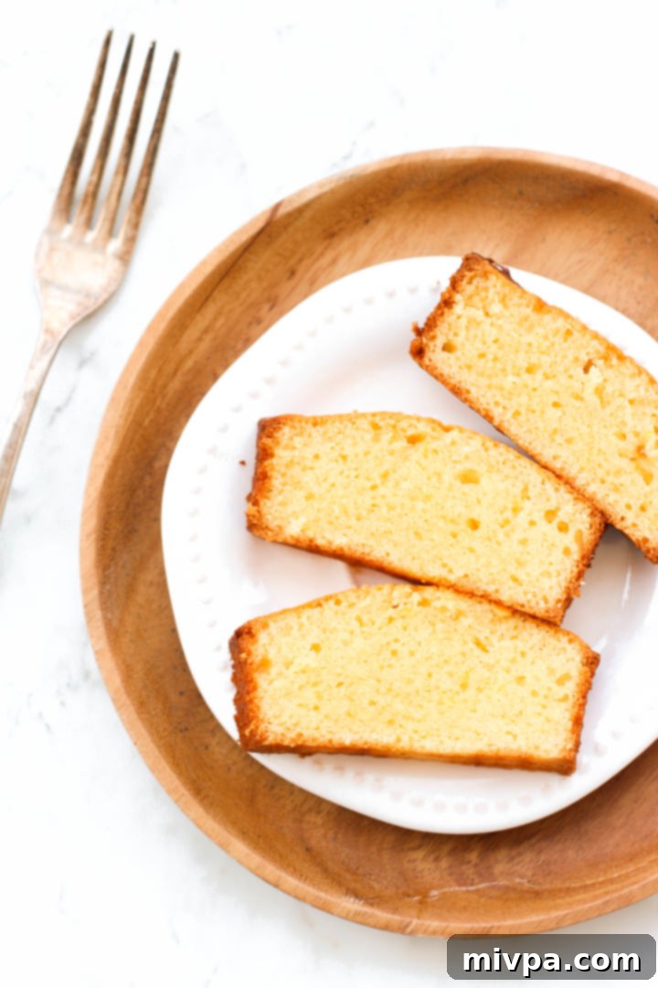 Top down shot of slices of gluen-free lemon yogurt cake on a plate.