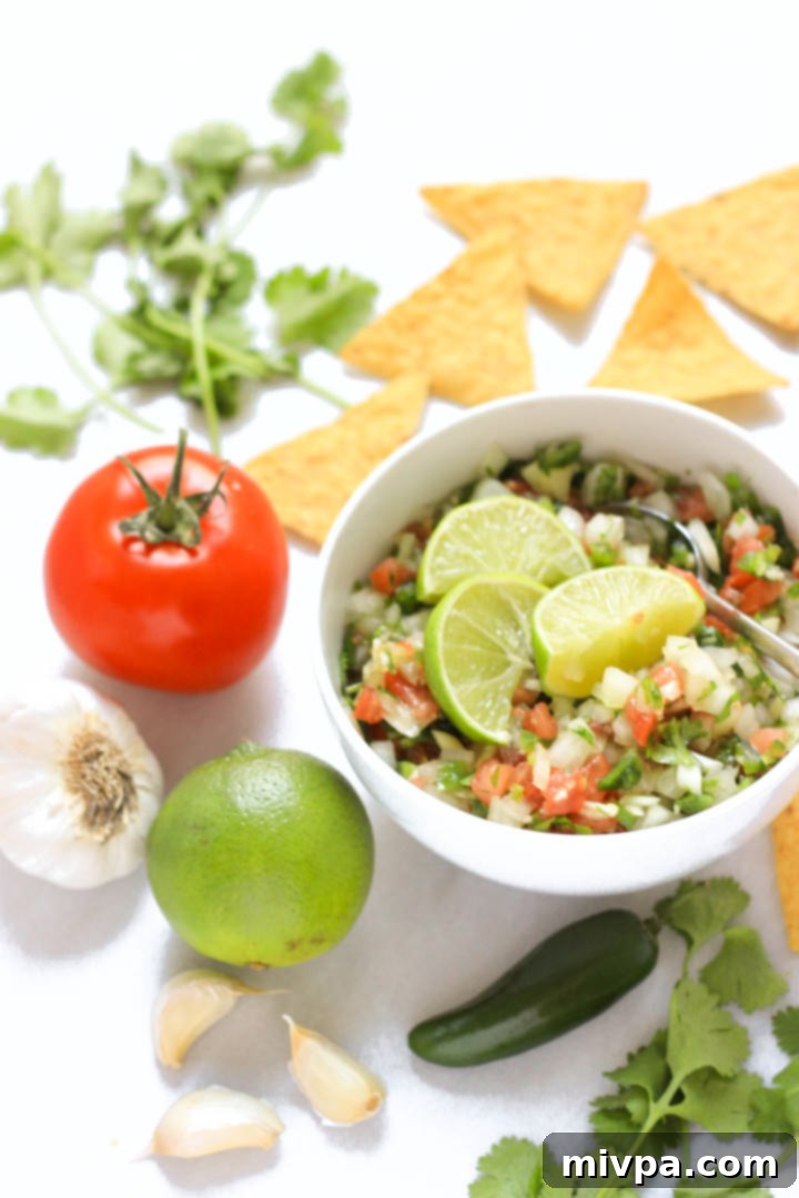 Bowl of pico de gallo and tortilla chips.