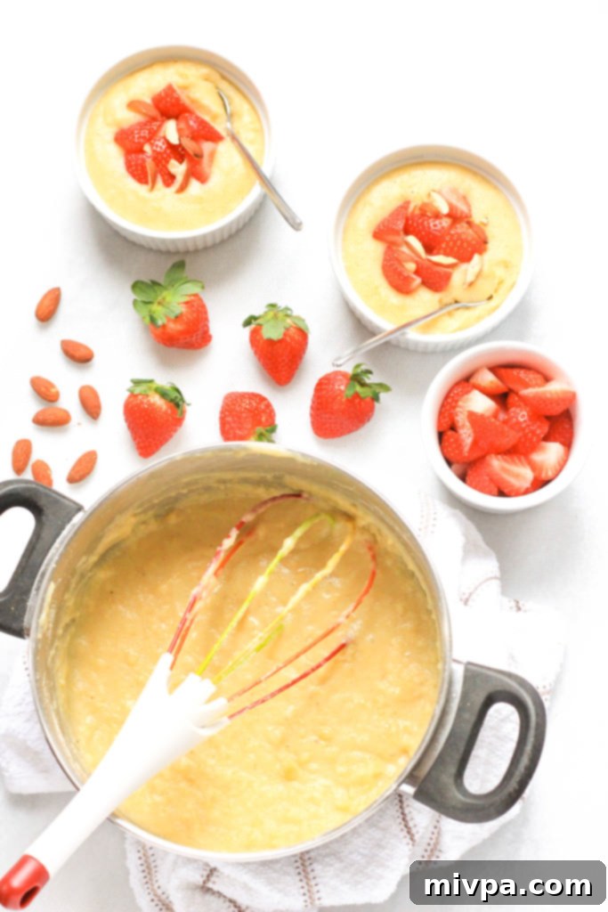 Ramekins of breakfast polenta with strawberries and almonds.