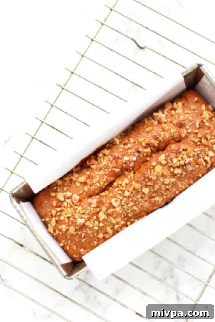 Gluten-free Banana Walnut Bread - A close-up shot of a freshly baked loaf, golden brown and inviting.