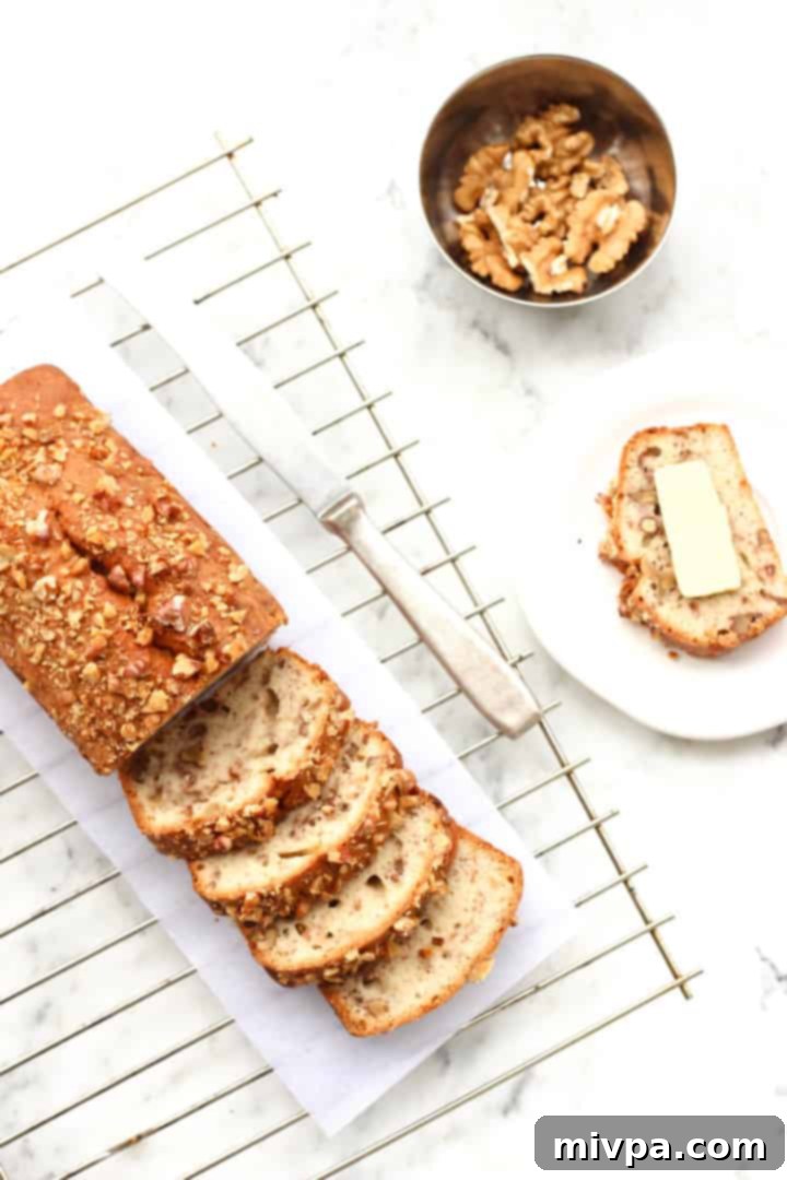 Gluten-free Banana Walnut Bread - A close-up of a slice of banana bread with walnuts, highlighting its texture.