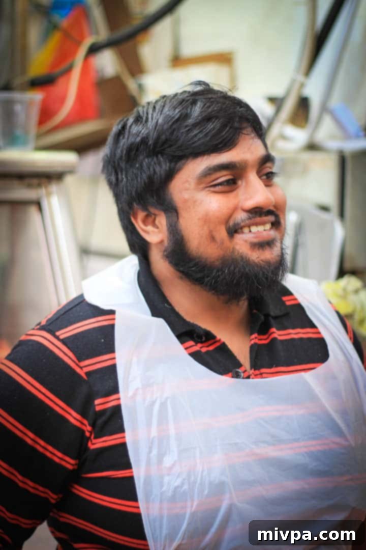 Little India - Market vendor smiling