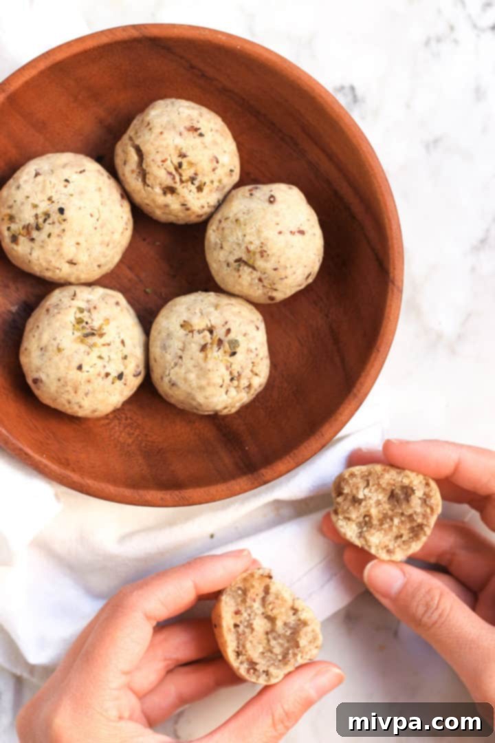 Close-up of freshly baked gluten-free bread rolls, showcasing their crispy texture and warm color, ready to be enjoyed.