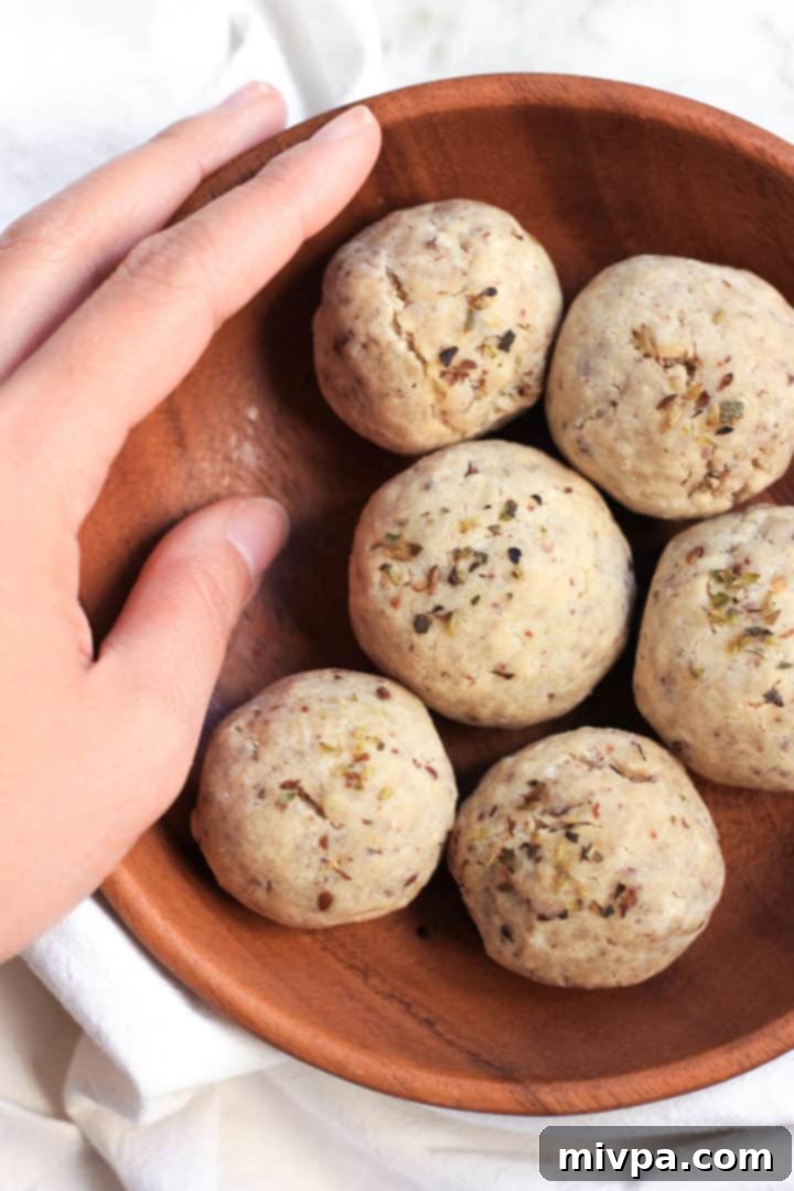 A bowl of flax egg mixture, a key binding agent for these vegan bread rolls, prepared and ready for use.