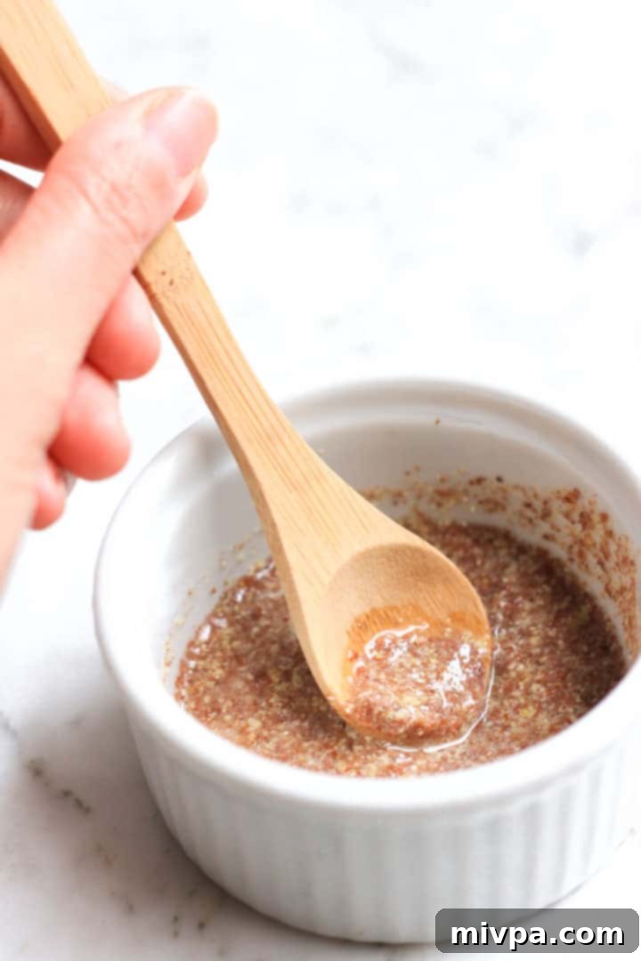 Cashew Butter Cookies (Gluten-Free, Vegan) Stirring a flax egg in a ramekin.