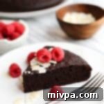 Gluten-Free Dairy-Free Coconut Chocolate Dream 2 A slice of coconut flour chocolate cake on plate.