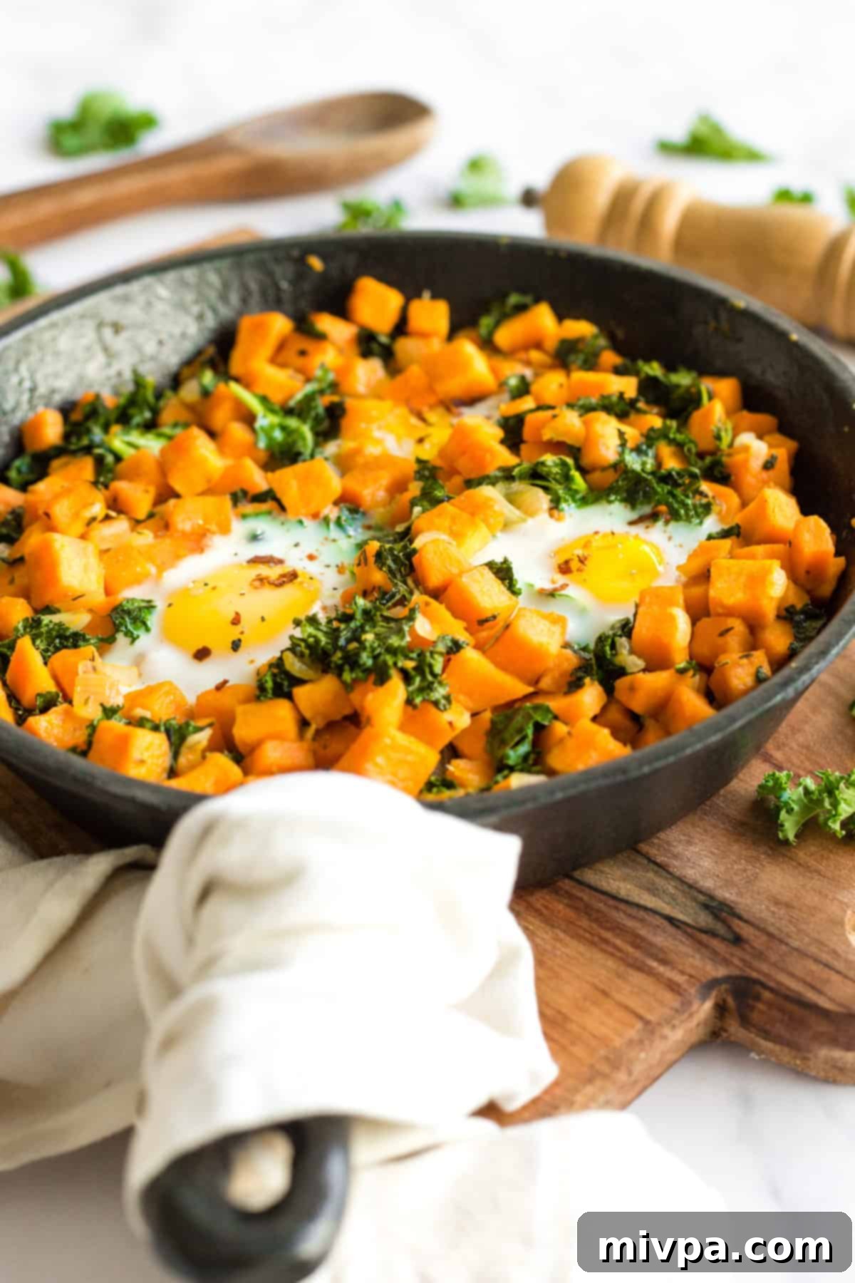 Sweet Potato & Kale Breakfast Skillet - A vibrant and healthy one-pan breakfast with eggs, sweet potatoes, and kale.