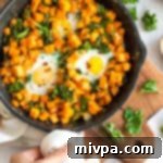 Sweet Potato and Kale Morning Skillet 11 Sweet Potato & Kale Breakfast Skillet with eggs, ready to eat.