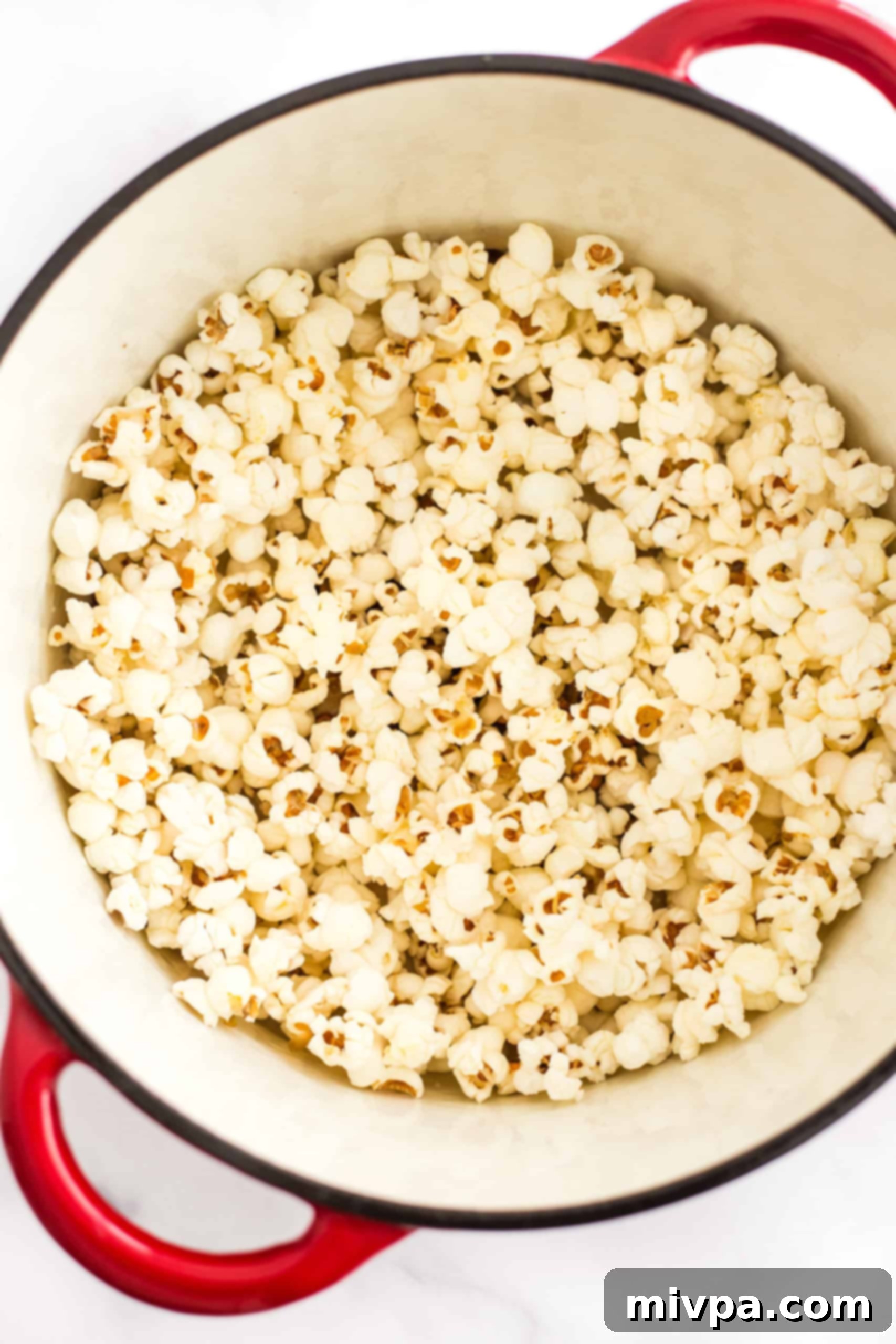 Easy Stovetop Popcorn (with Microwave option) Freshly popped stovetop popcorn in a Dutch oven.