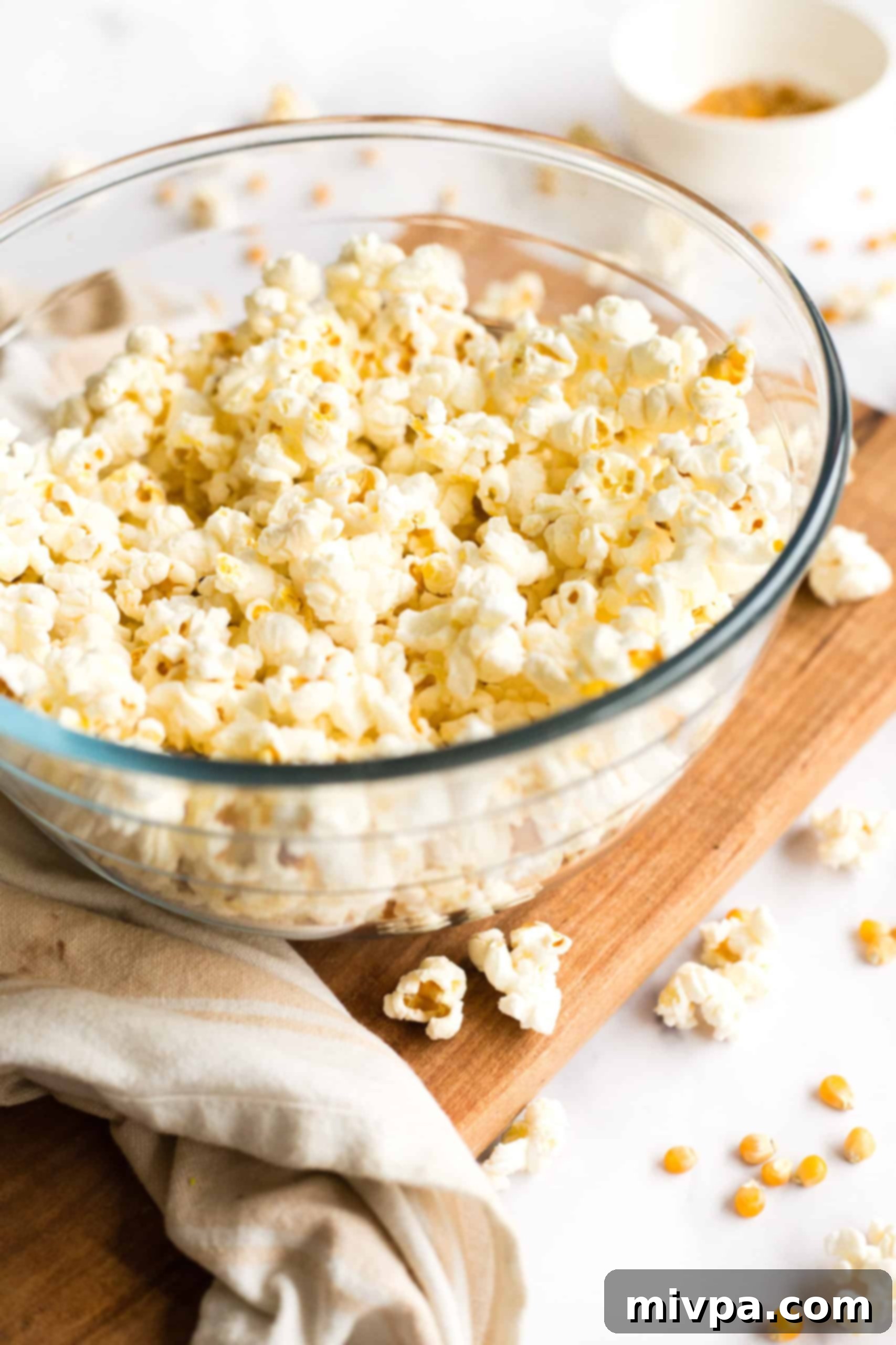 Easy Stovetop Popcorn (with Microwave option) A bowl full of freshly popped microwave popcorn.