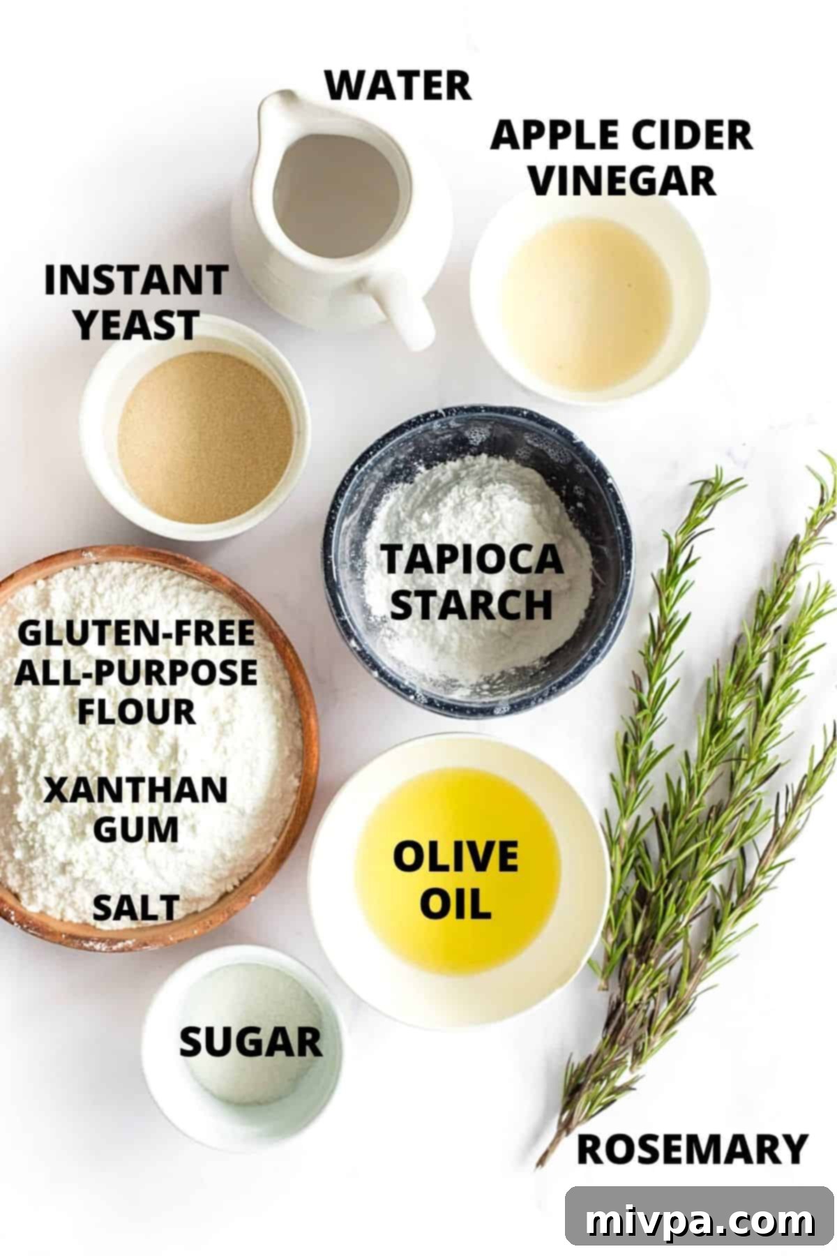The Best Gluten-Free Focaccia Bread (Dairy-Free, Vegan) Ingredients for gluten-free focaccia recipe laid out on marble board.