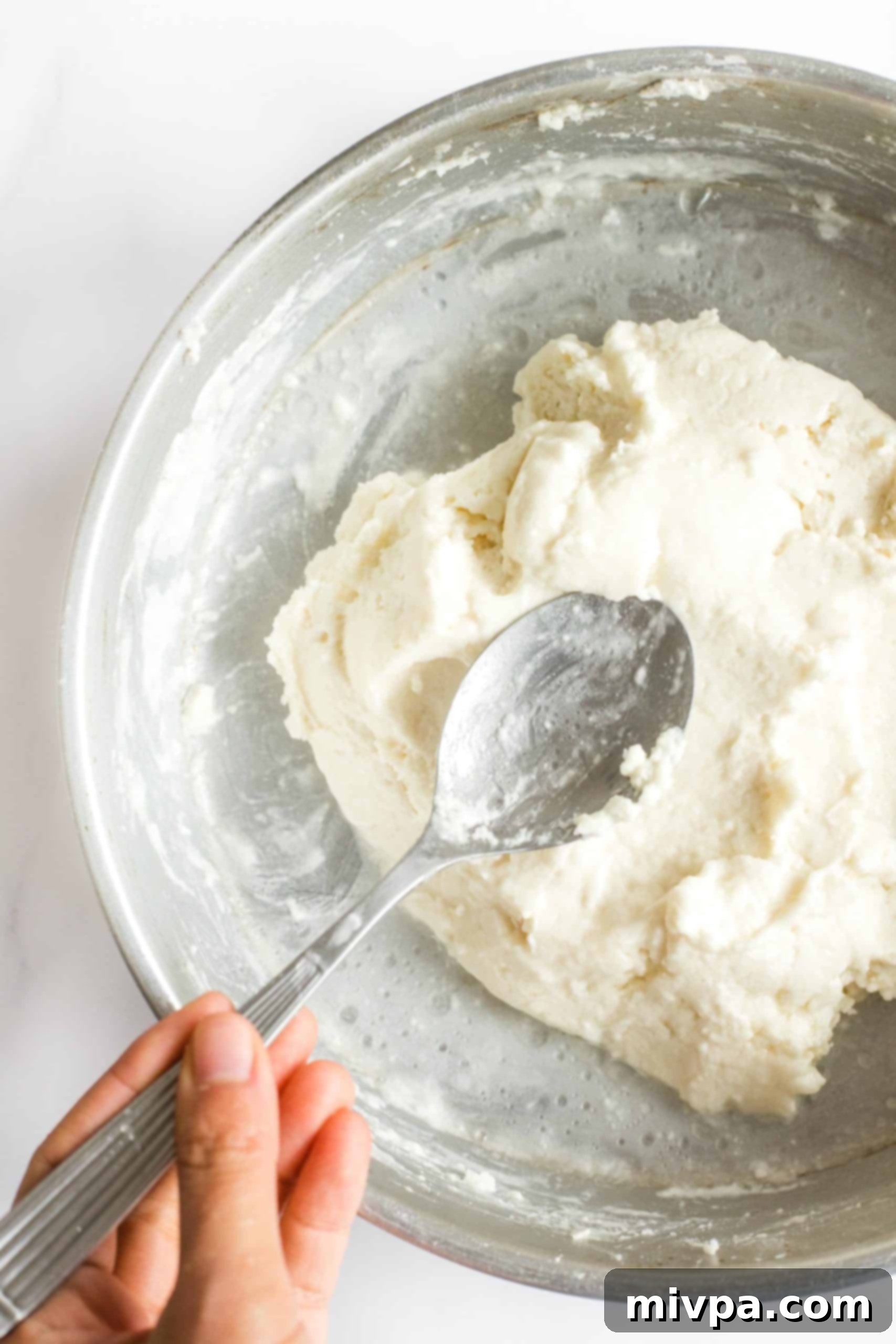 The Best Gluten-Free Focaccia Bread (Dairy-Free, Vegan) Preparing the dough for gluten-free rosemary focaccia bread.