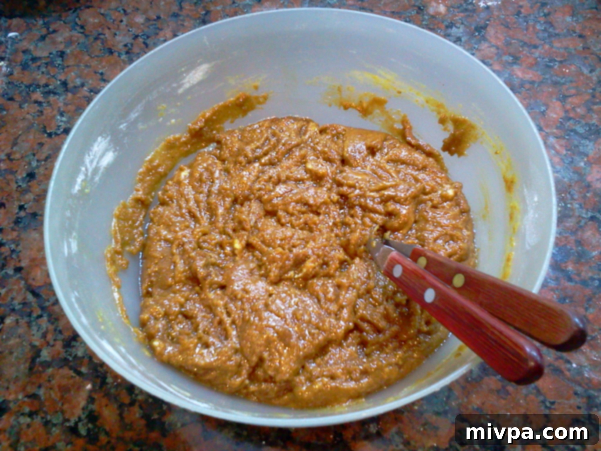 The fully combined cookie batter after flour and eggs have been mixed in, showing a thick consistency.