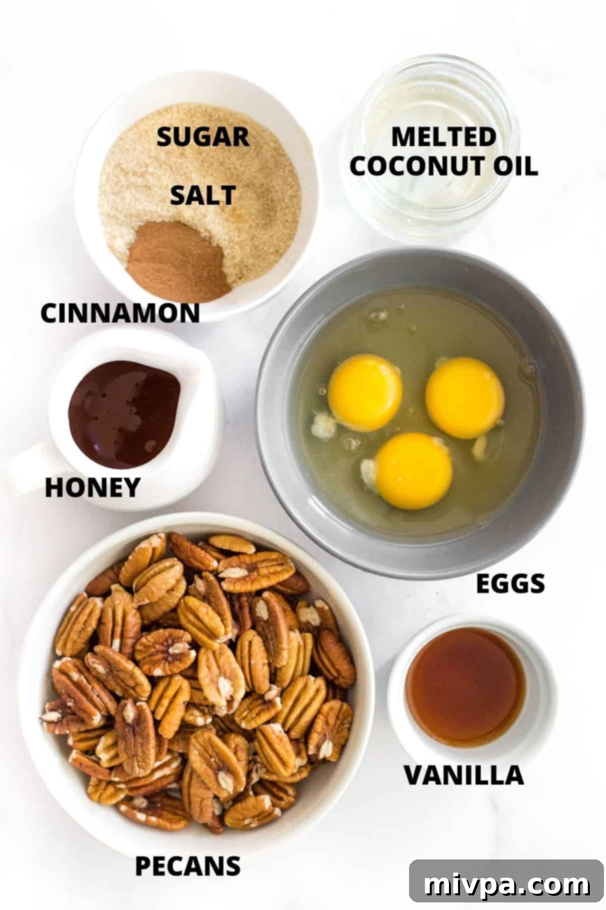 Easy Gluten-Free Pecan Pie Recipe (Dairy-Free) Labeled ingredients for gluten-free pecan pie recipe laid out on marble board.