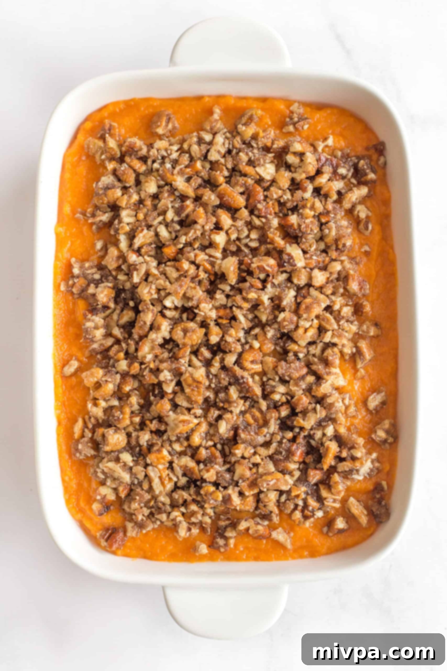 Gluten-Free Sweet Potato Casserole (Dairy-Free) Gluten-free sweet potato casserole on a marble board.
