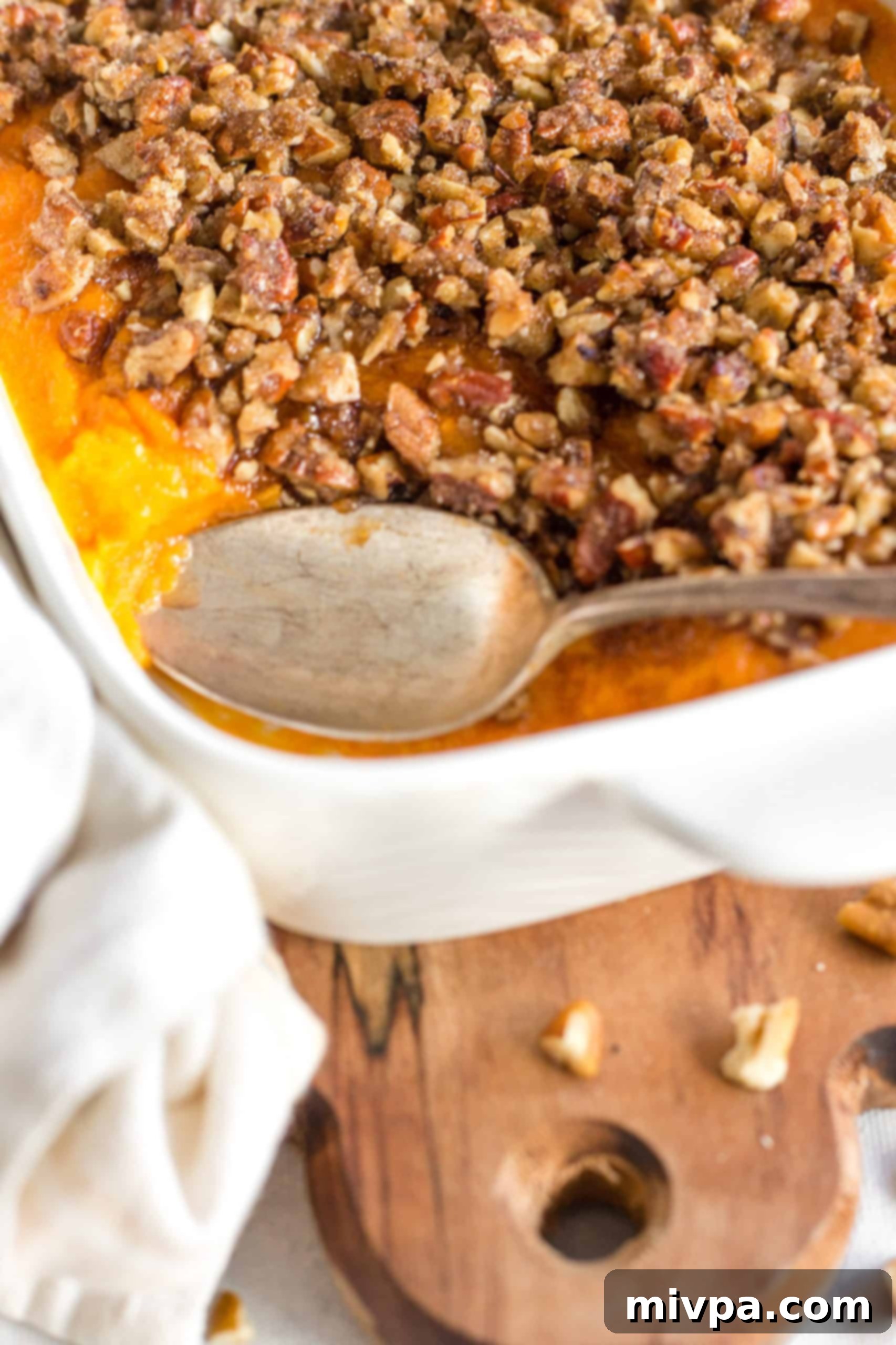 Gluten-Free Sweet Potato Casserole Recipe (Dairy-Free) Spoon in the casserole dish.