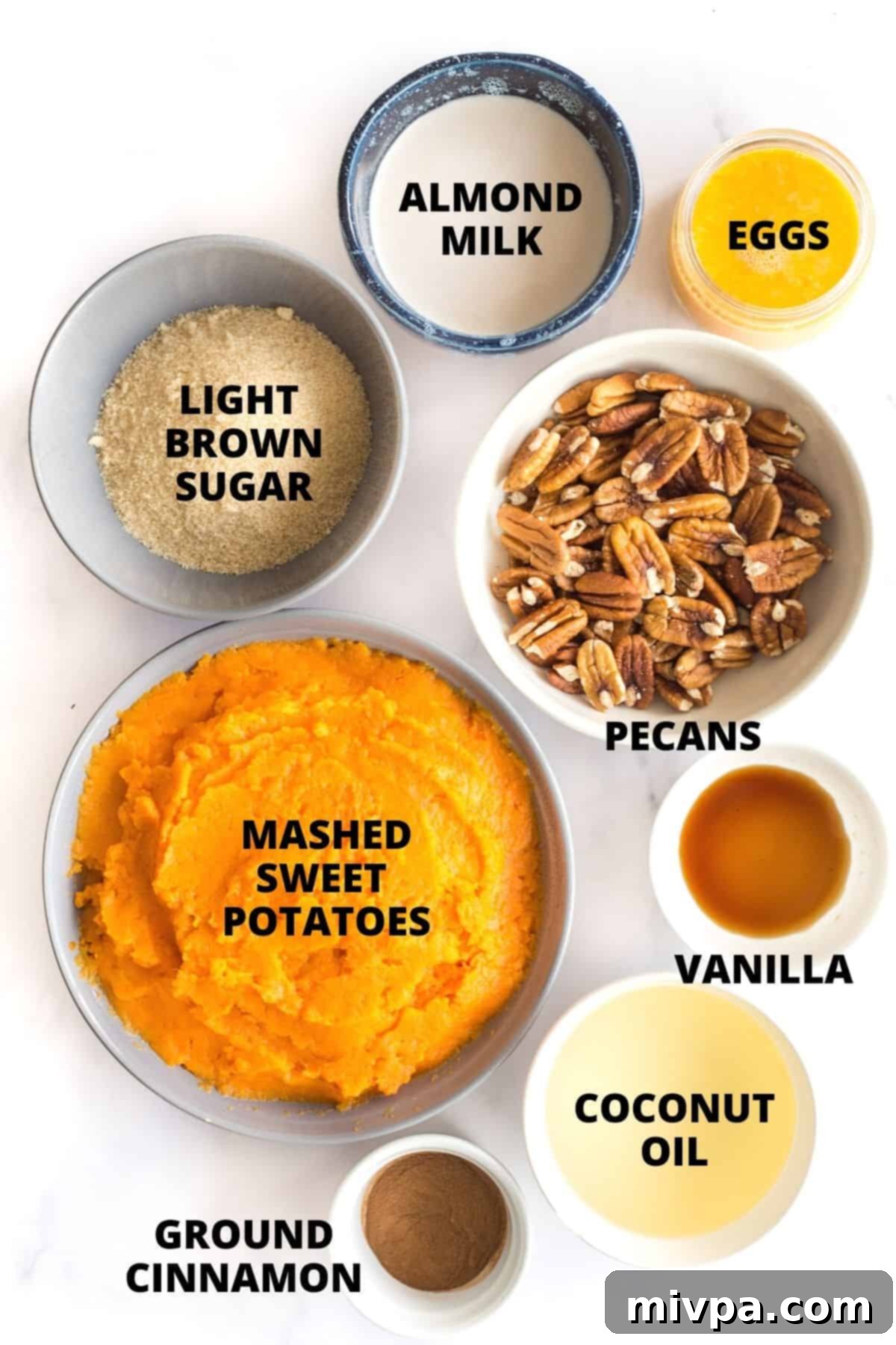 Gluten-Free Sweet Potato Casserole Recipe (Dairy-Free) Labeled ingredients for gluten-free sweet potato casserole on a marble board.