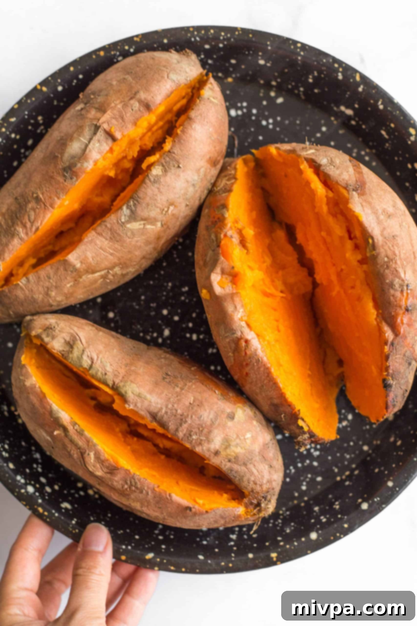 Gluten Dairy Free Sweet Potato Casserole Baked sweet potatoes sliced into half lengthwise.