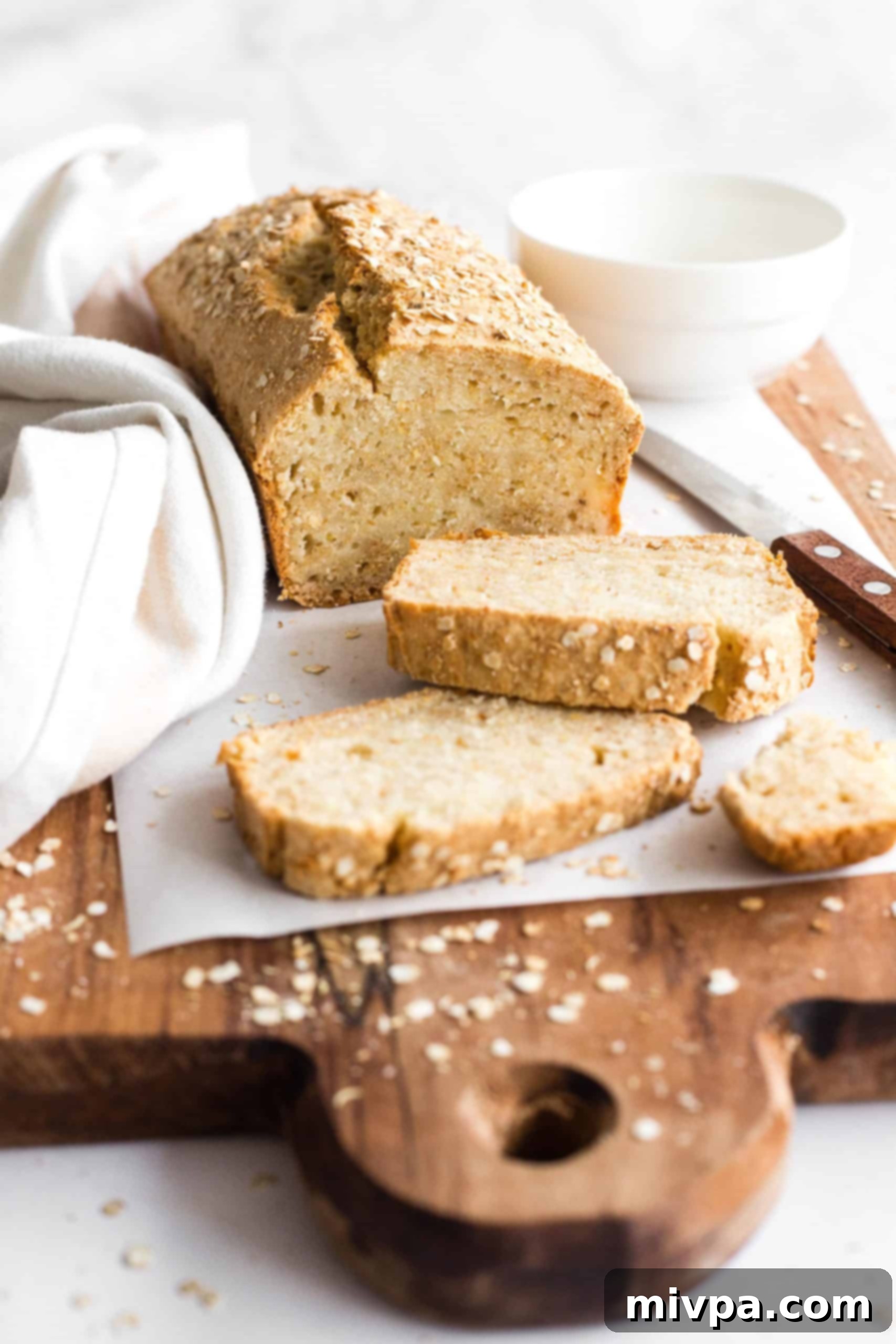 Up close shot of a sliced loaf of quinoa bread.