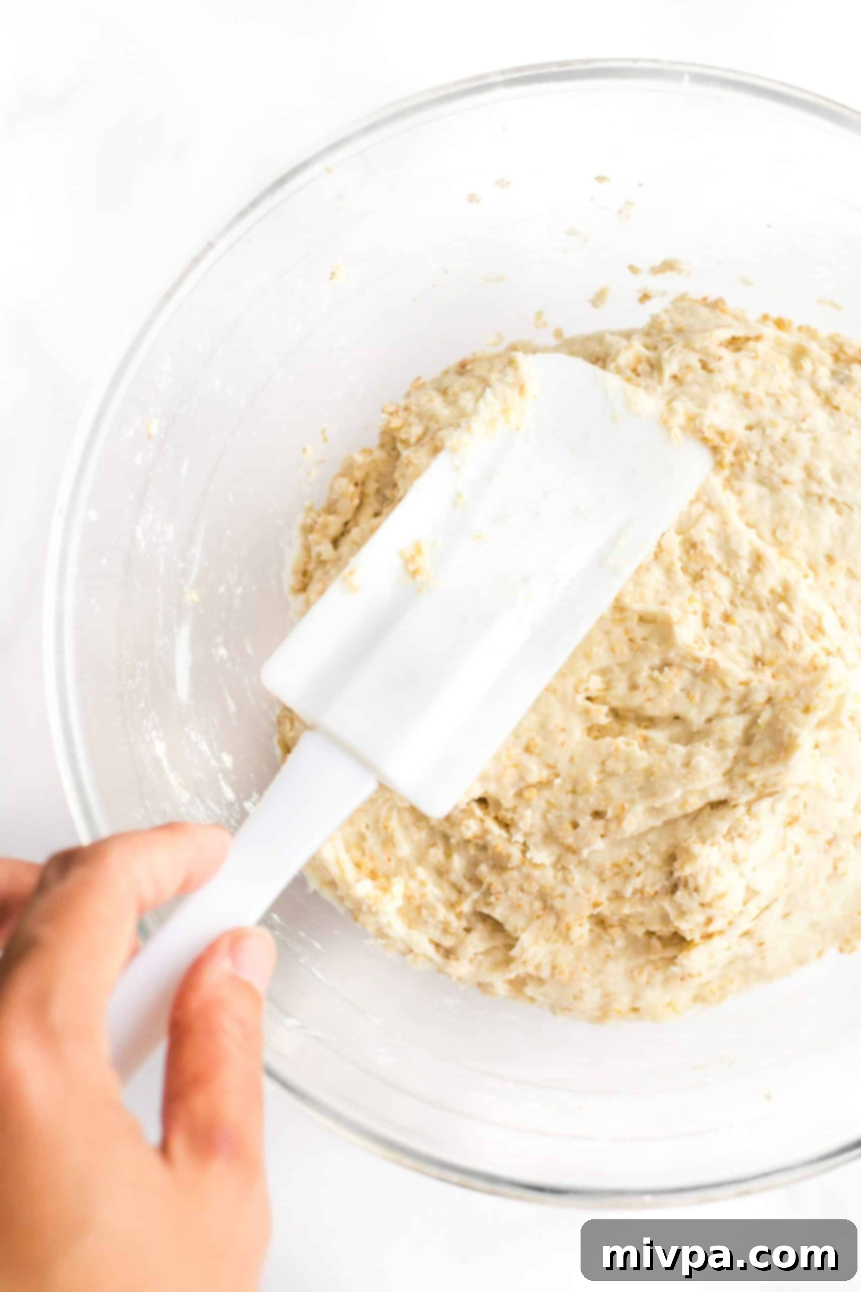 Preparing batter in a glass bowl.