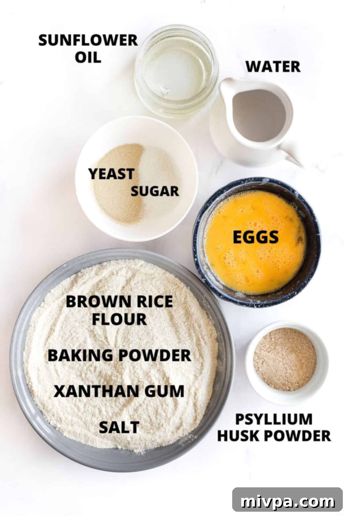 Ingredients required for making brown rice bread laid out on a marble board.