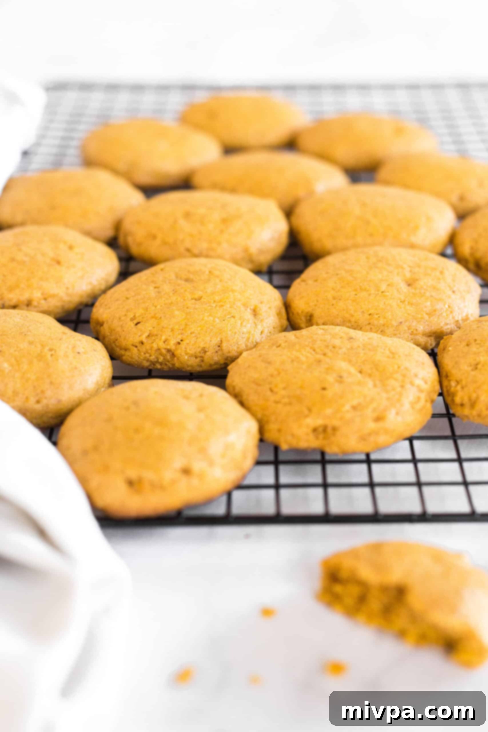 Gluten-free pumpkin cookies cooling on a wire rack.
