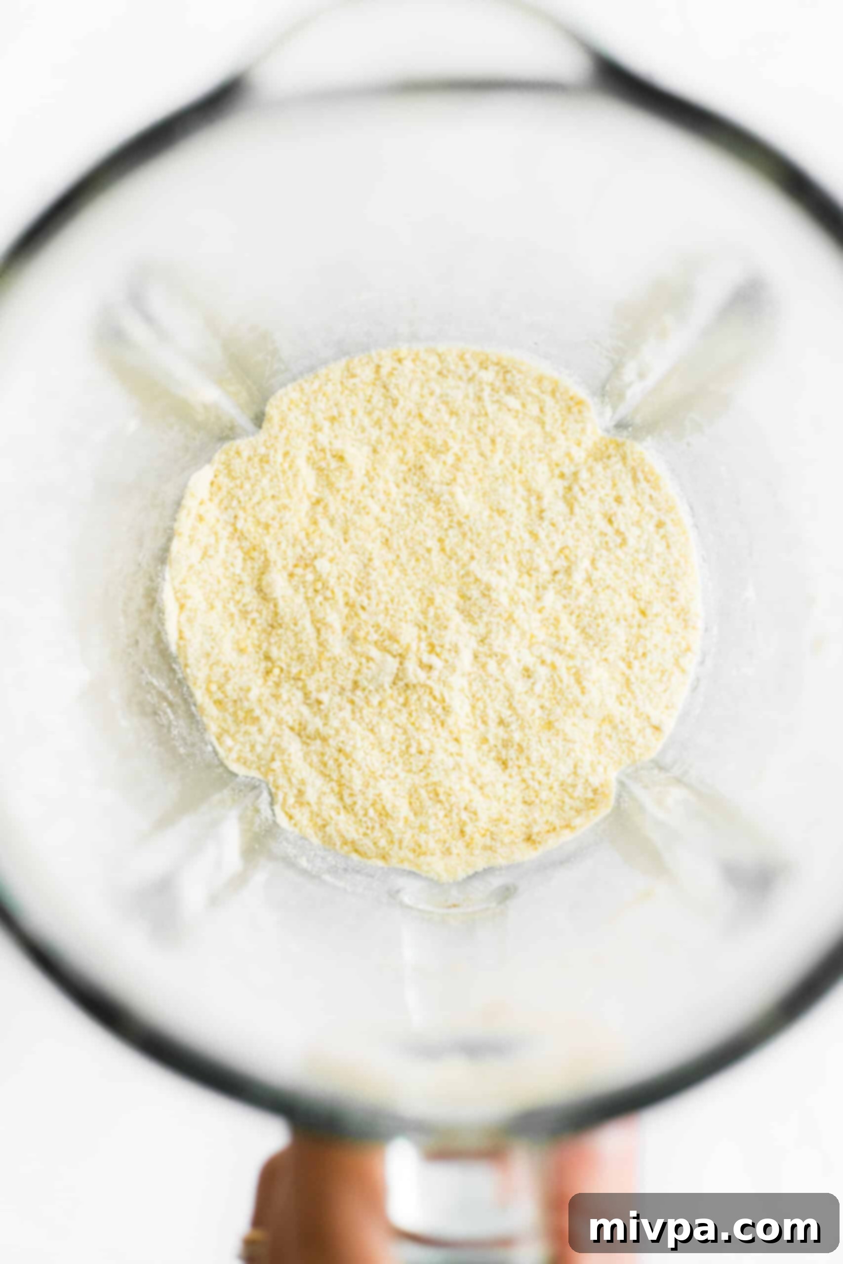 Freshly ground homemade millet flour in a blender.